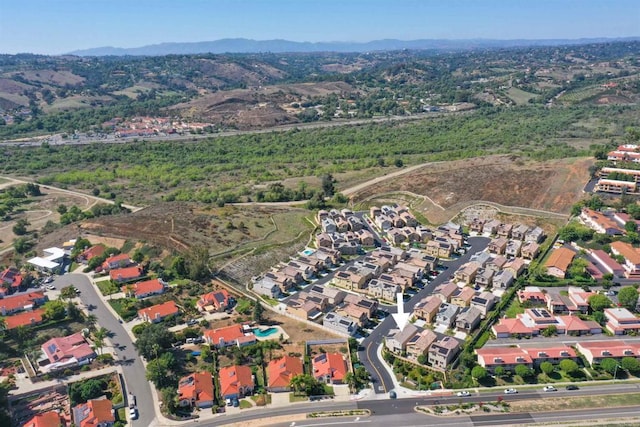 birds eye view of property with a residential view and a mountain view