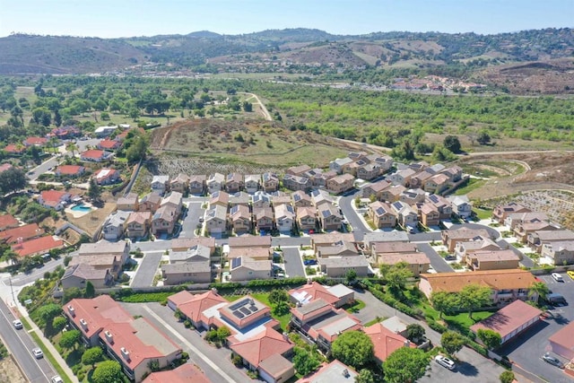 aerial view featuring a mountain view and a residential view