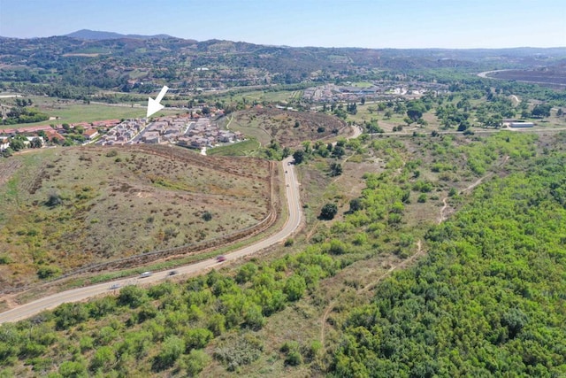 birds eye view of property featuring a mountain view