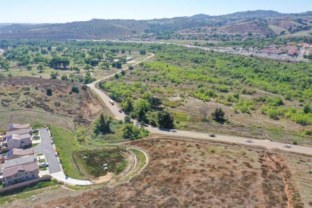 birds eye view of property featuring a mountain view