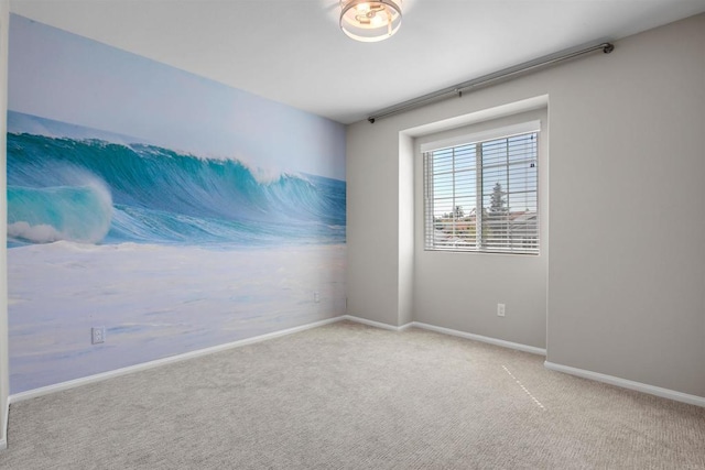 empty room with light carpet and baseboards