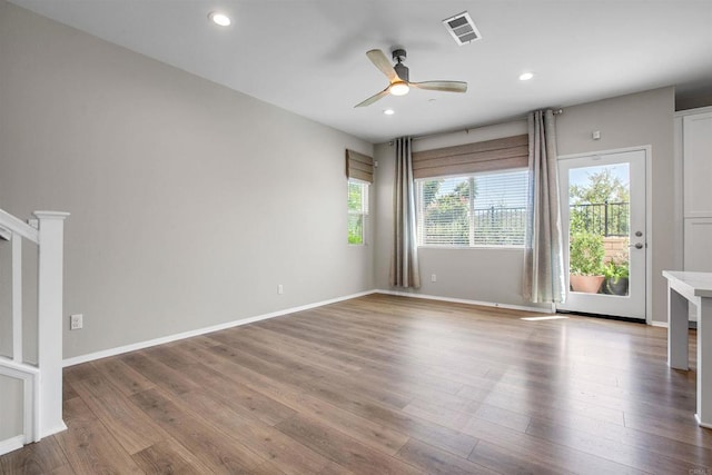 spare room featuring recessed lighting, visible vents, ceiling fan, wood finished floors, and baseboards