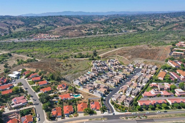 birds eye view of property with a residential view and a mountain view