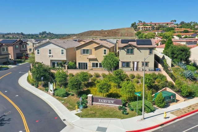 birds eye view of property with a residential view