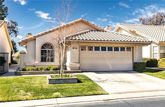 mediterranean / spanish-style home featuring a garage, a tiled roof, concrete driveway, and stucco siding