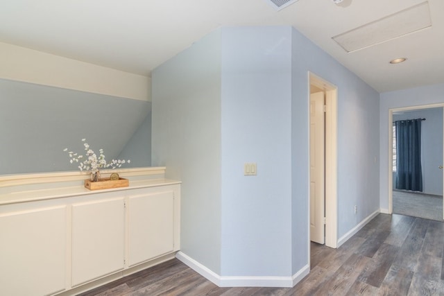 hall featuring recessed lighting, baseboards, and dark wood-style flooring