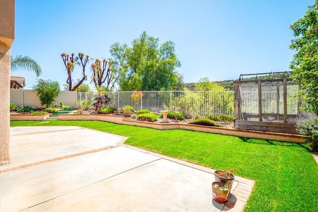 view of yard with a fenced backyard and a patio area