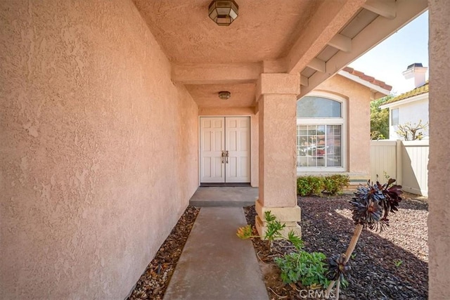 property entrance with fence