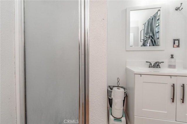 bathroom featuring vanity and walk in shower