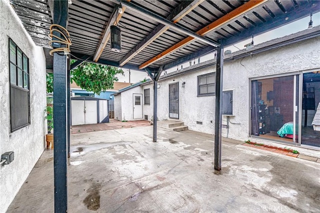 view of patio / terrace with a storage shed