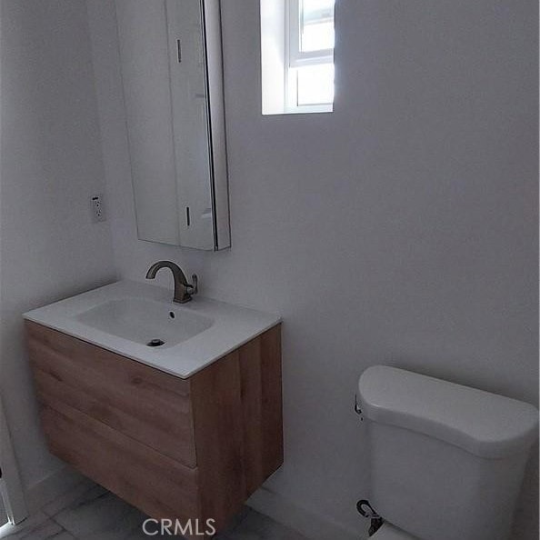 half bath with toilet and vanity