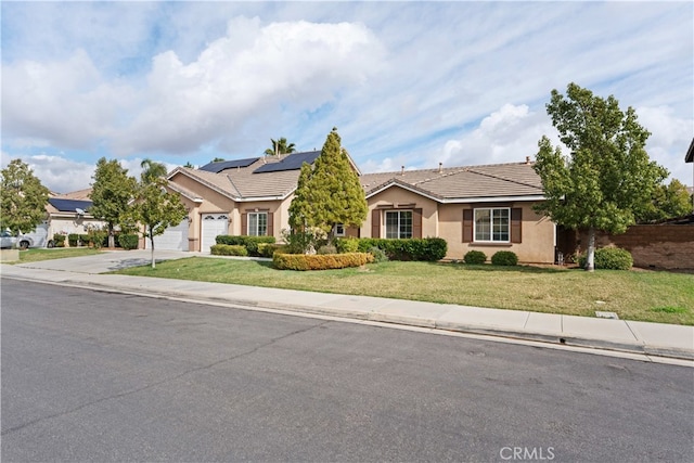 ranch-style house with a front lawn, a tile roof, concrete driveway, stucco siding, and an attached garage