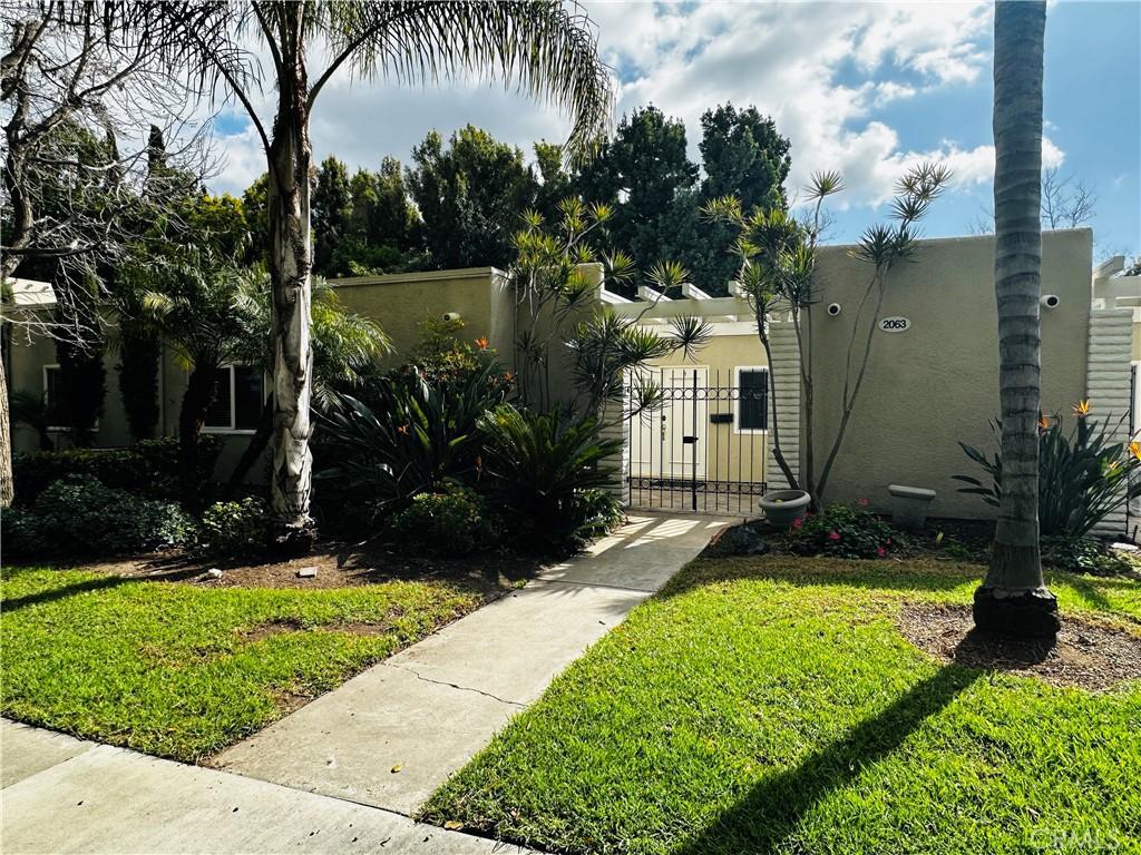 view of gate featuring a yard