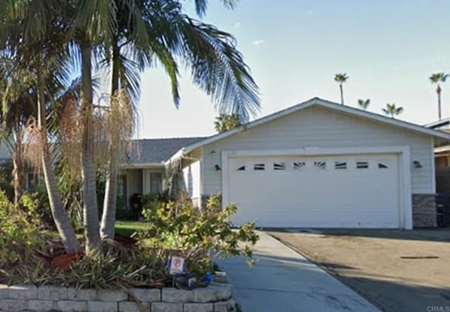 ranch-style home featuring a garage