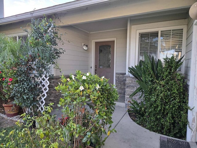 view of exterior entry with stone siding