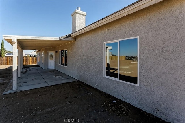 back of property featuring a patio area