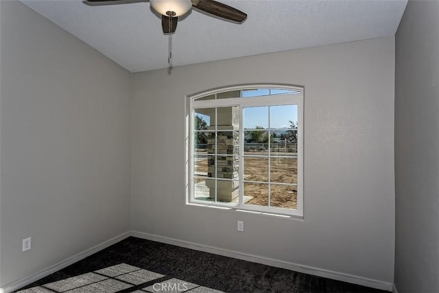 empty room featuring carpet floors and ceiling fan