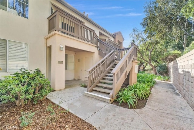 doorway to property featuring a patio area and a balcony