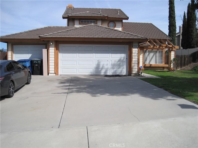 view of front of home featuring driveway and a garage