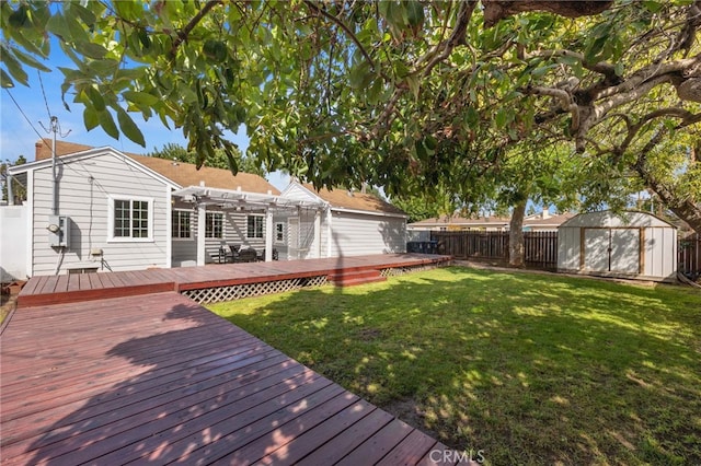 view of yard with a wooden deck, a fenced backyard, a pergola, an outdoor structure, and a storage unit