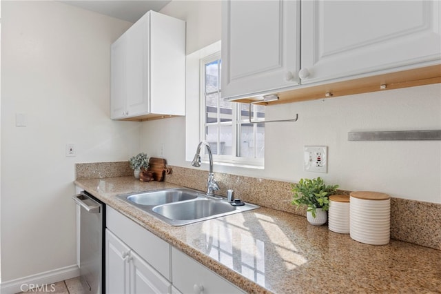 kitchen featuring a sink, dishwasher, white cabinets, and light countertops