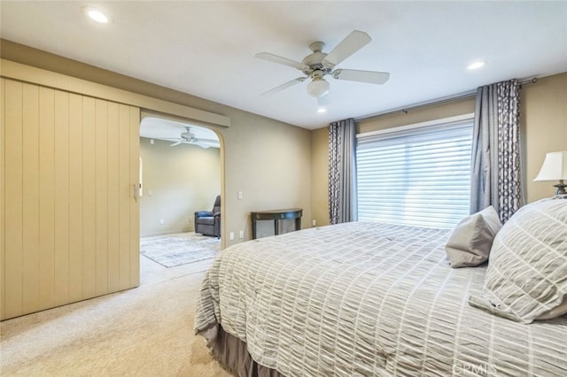 carpeted bedroom with ceiling fan