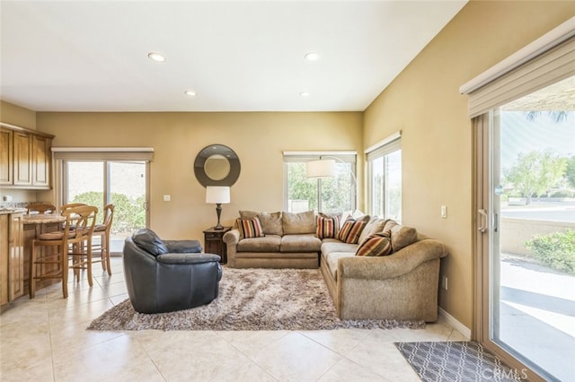 living room featuring a healthy amount of sunlight and light tile patterned floors