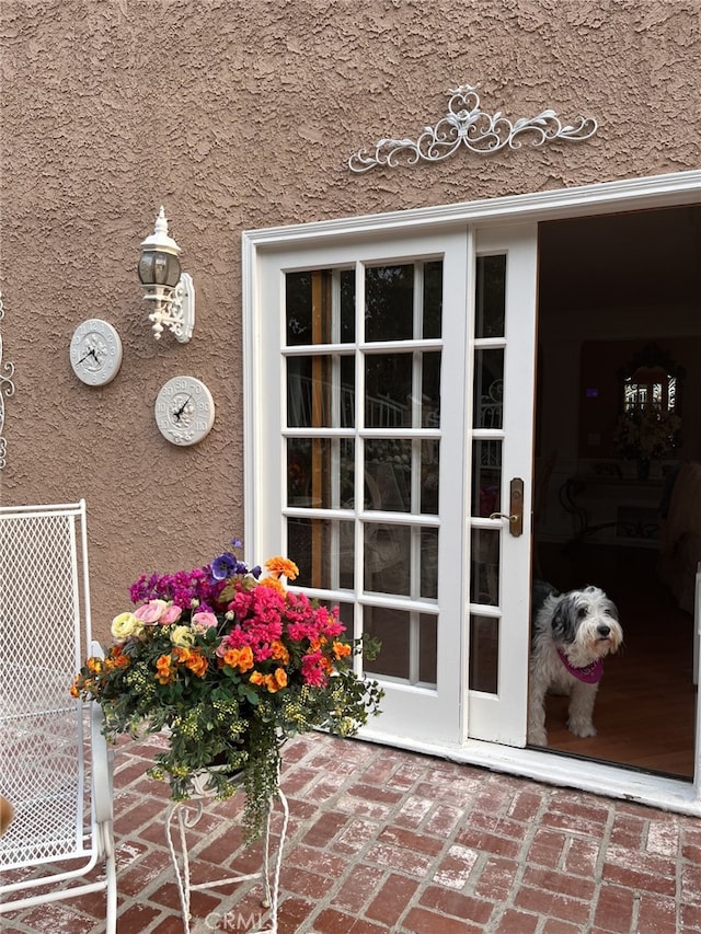 doorway to property with stucco siding