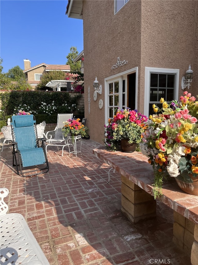 view of patio / terrace featuring fence