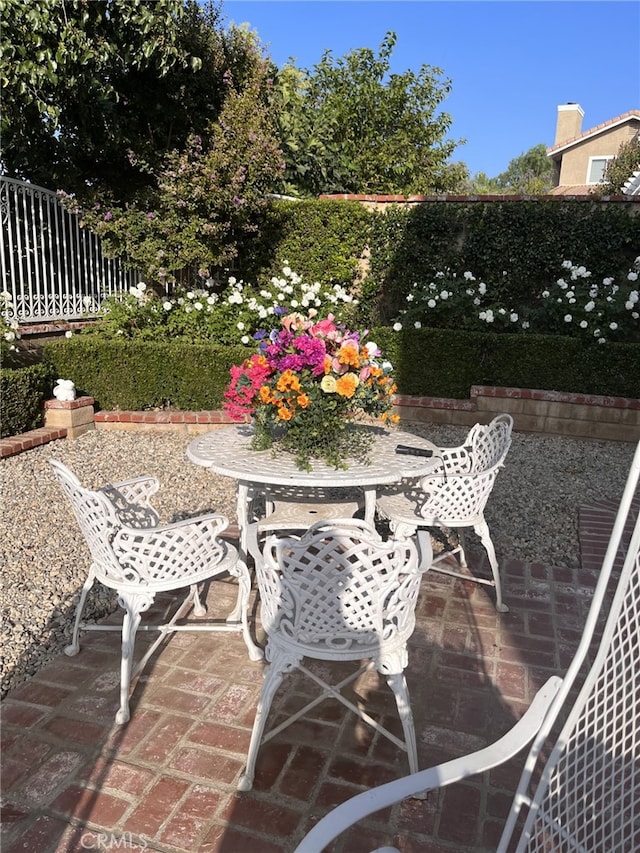 view of patio / terrace featuring outdoor dining area and fence