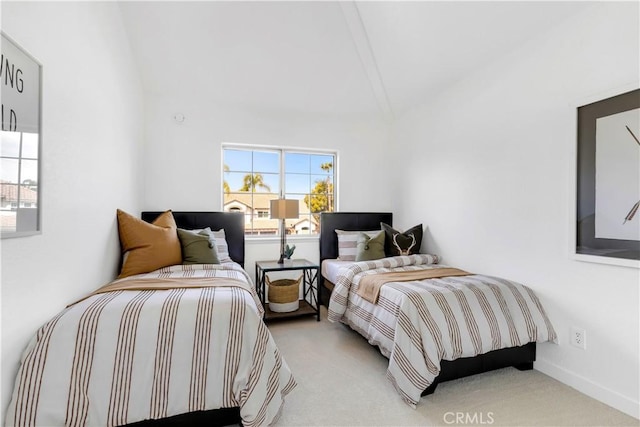 bedroom featuring lofted ceiling and carpet floors