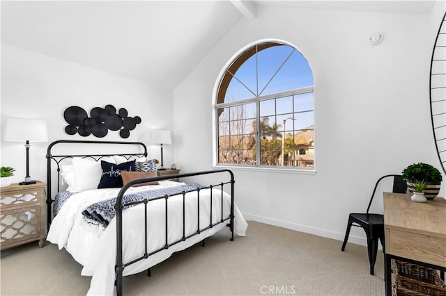 bedroom with carpet floors, beamed ceiling, high vaulted ceiling, and baseboards