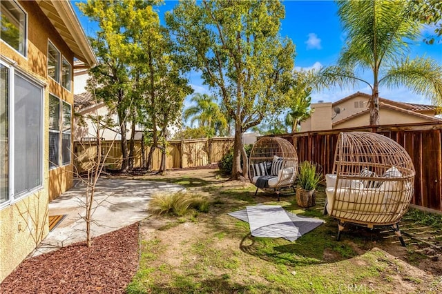 view of yard with a fenced backyard and a patio