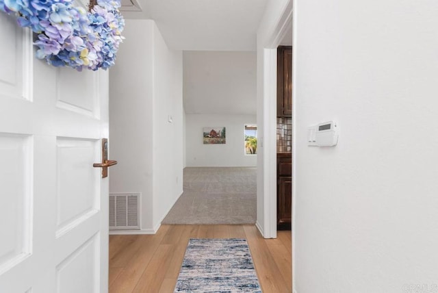 corridor featuring light hardwood / wood-style floors