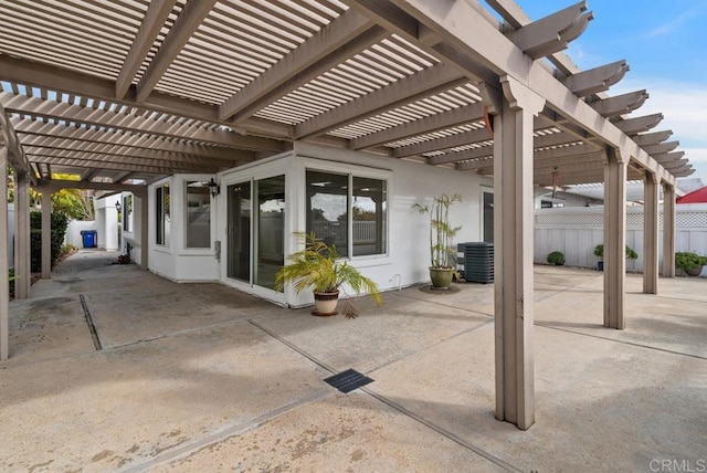 view of patio / terrace featuring cooling unit and a pergola