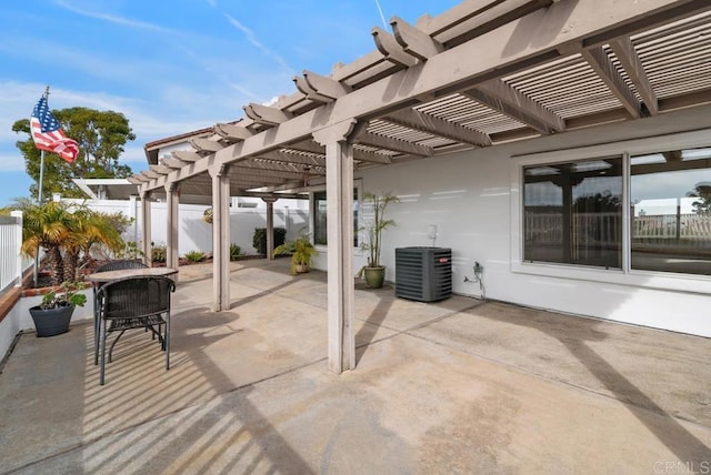 view of patio / terrace with central AC and a pergola