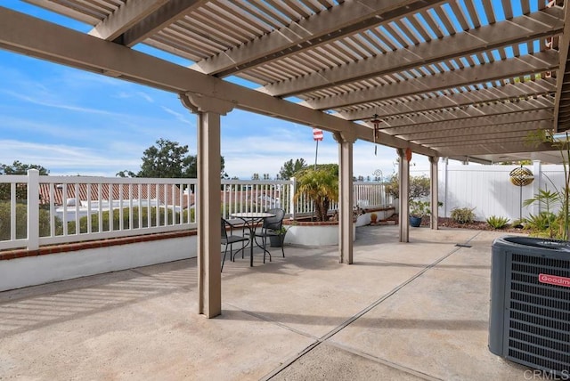 view of patio with central AC and a pergola