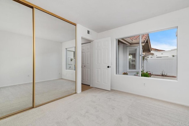 unfurnished bedroom featuring carpet floors