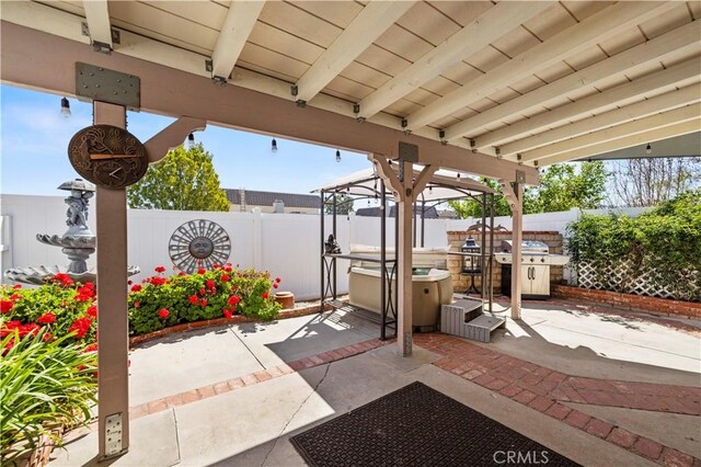 view of patio / terrace featuring area for grilling and a fenced backyard