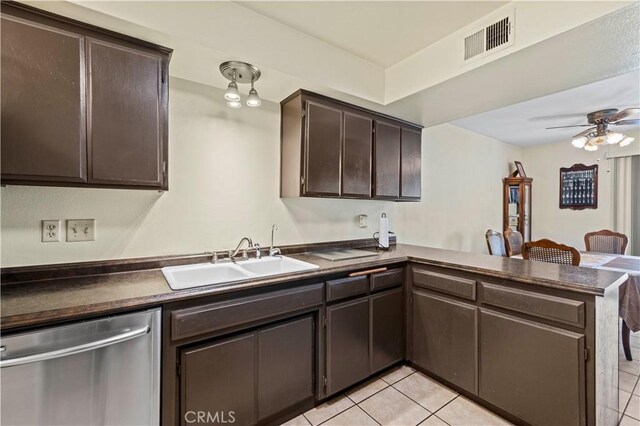 kitchen featuring a sink, dark countertops, visible vents, and dishwasher