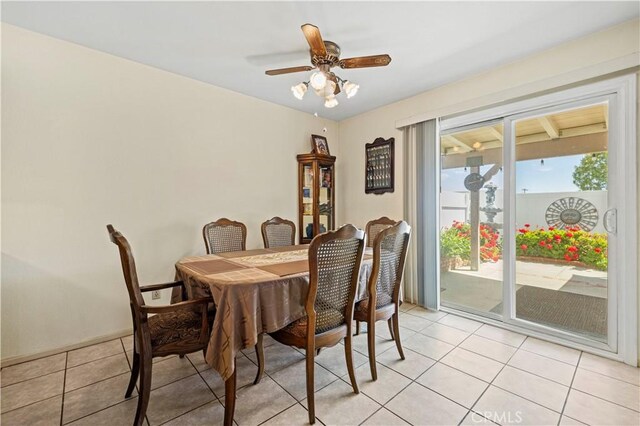 dining area featuring light tile patterned floors and a ceiling fan