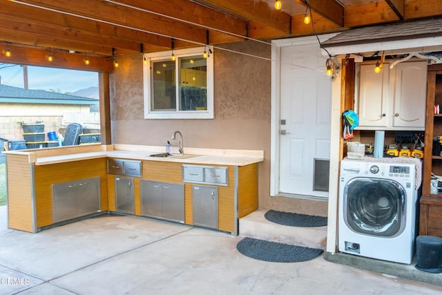 interior space with sink and washer / clothes dryer