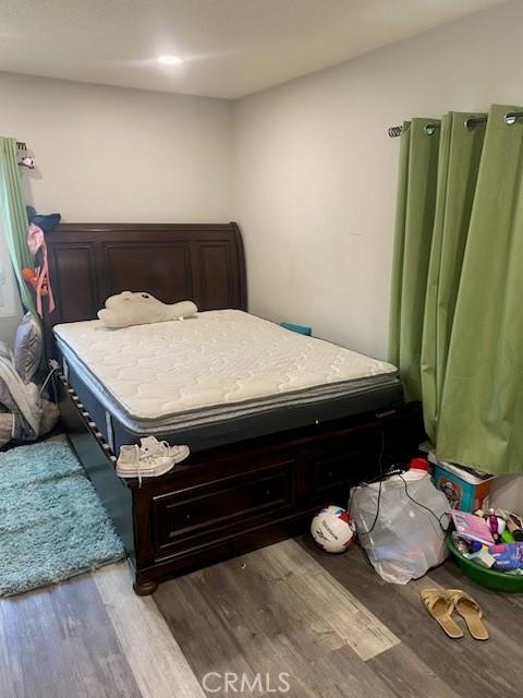 bedroom featuring hardwood / wood-style flooring