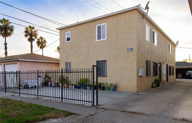 view of side of property with a garage