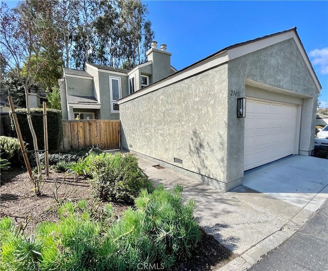 view of side of property featuring a garage