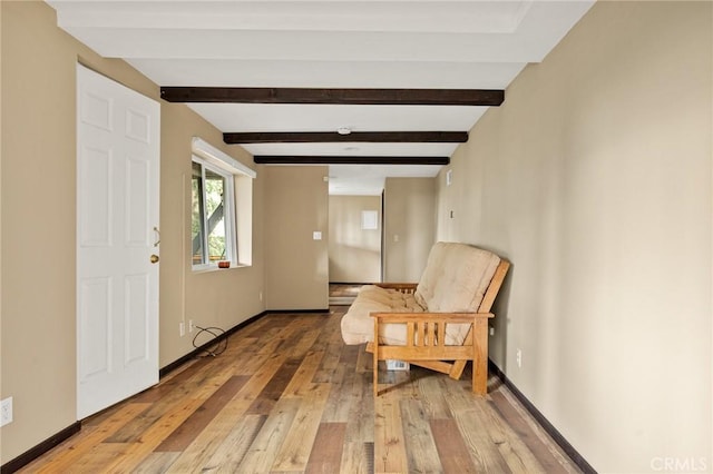 entrance foyer with beamed ceiling and hardwood / wood-style flooring