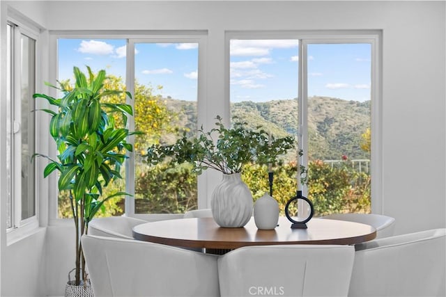 sunroom with a mountain view