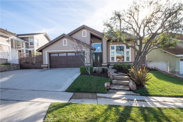 view of front of property featuring a garage and a front yard