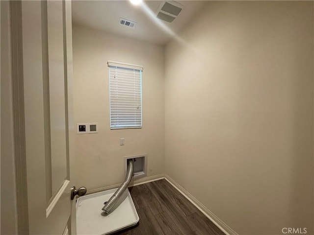 clothes washing area featuring laundry area, baseboards, visible vents, dark wood-type flooring, and hookup for a washing machine