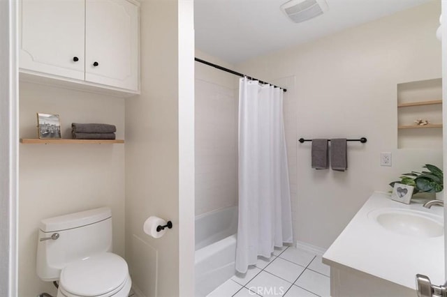 bathroom with tile patterned floors, visible vents, toilet, vanity, and baseboards